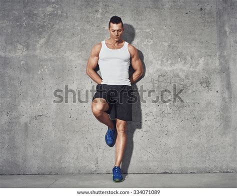 Young Man In White Tank Top Looks Down: Over 120 Royalty-Free ...