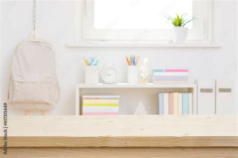 Blank wooden table top on blurred schoolchild room interior background ...