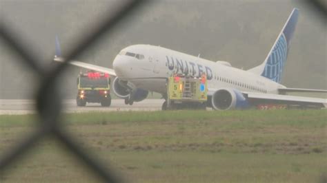 United Airlines plane rolls off runway at Houston airport