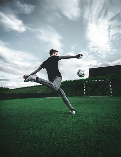 man playing soccer during daytime photo – Free Human Image on Unsplash