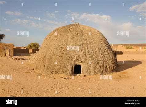 Traditional house made of straw on the countryside in the saharan ...