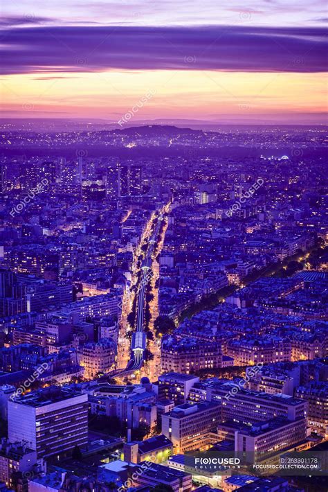 Aerial view of Paris cityscape at night, France — travel, purple ...