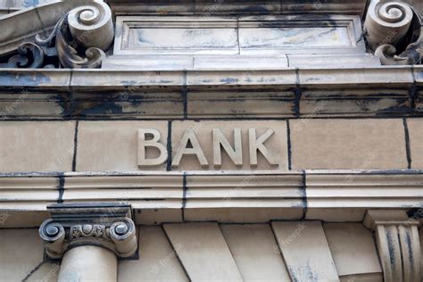 Premium Photo | Bank Sign on Building Facade