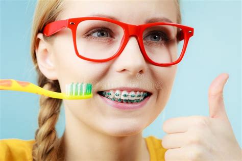 Woman with Teeth Braces Using Brush Stock Image - Image of cleaning ...