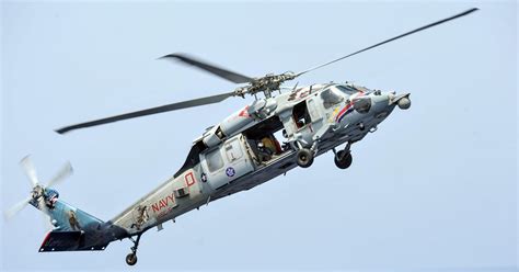 U.S. Navy helicopter crashes; search on for 5 crew