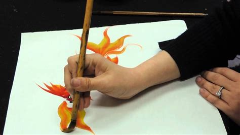 a tutorial on how to make goldfishes in chinese painting style ...