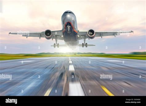 Aircraft speed on the landing runway at dawn Stock Photo - Alamy