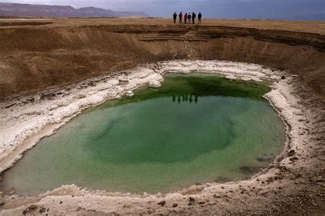 Sinkholes on receding Dead Sea shore mark 'nature's revenge'