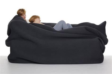 A Bean Bag Bed With Built-in Blanket and Pillow