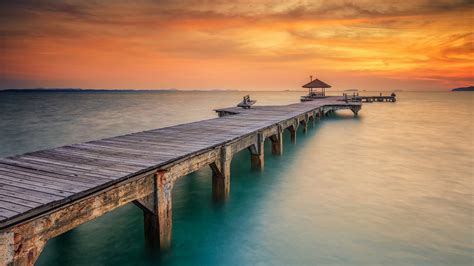 Download Sunset Ocean Man Made Pier HD Wallpaper