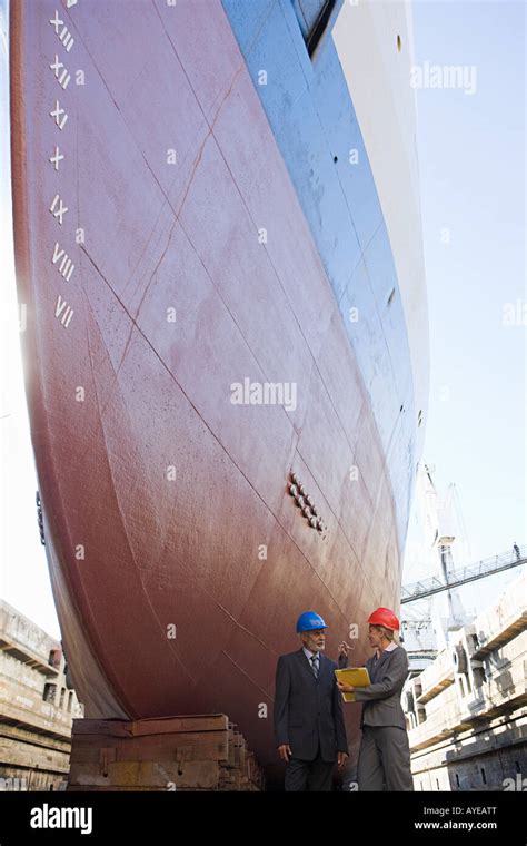 Engineers by ship Stock Photo - Alamy