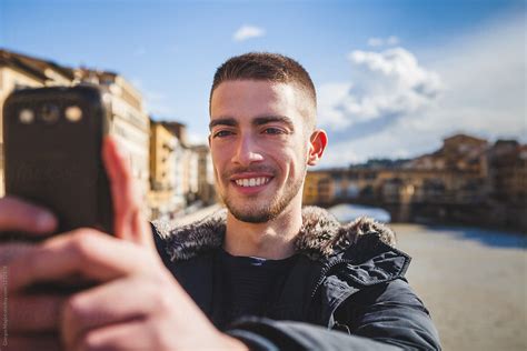 "Young Man Taking A Selfie With A Mobile Phone In Florence" by Stocksy ...