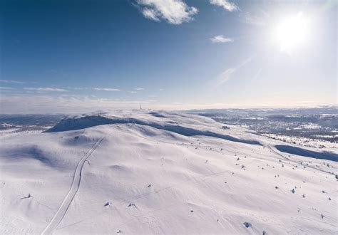 Aerial Photography Of Snowy Hill · Free Stock Photo