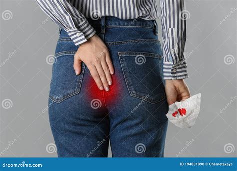 Woman Suffering from Hemorrhoid and Holding Toilet Paper with Blood ...