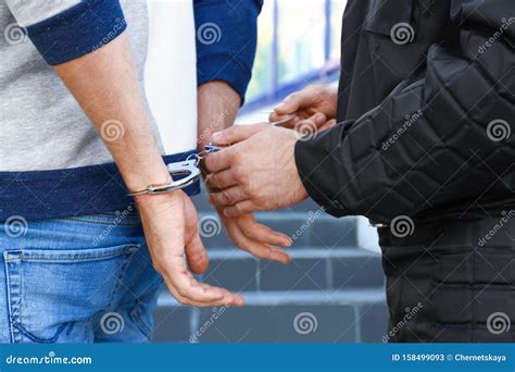 Police Officer Putting Handcuffs on Criminal, Closeup Stock Image ...