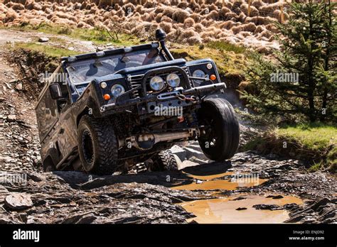 Land rover defender off road landrover defender off road Stock Photo ...