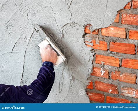 Mason Plastering The Concrete To Build Wall, Construction Under ...