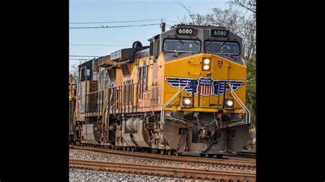 Union Pacific Loaded Pipe Train w/ a CSX YN2 Paint Scheme trailing ...