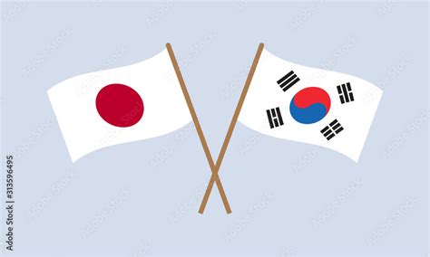 Japan and South Korea crossed flags on stick. Japanese and South Korean ...