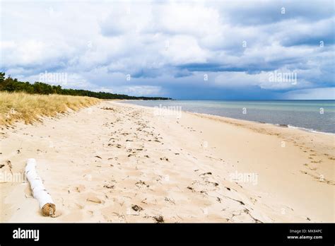 Ahus, Sweden. Rainclouds approaching the sandy beach Stock Photo - Alamy