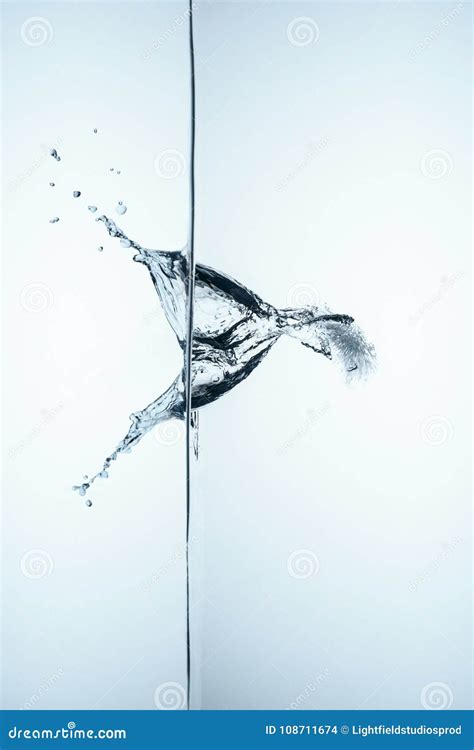 Ice Cube in Water with Splash and Drops Stock Photo - Image of ...