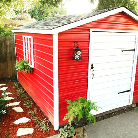 After looking at our old white rusty metal shed, we decided it needed a ...