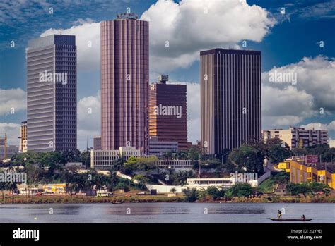 Abidjan, Ivory Coast, Cote d'Ivoire. Pirogue and Abidjan Skyline ...