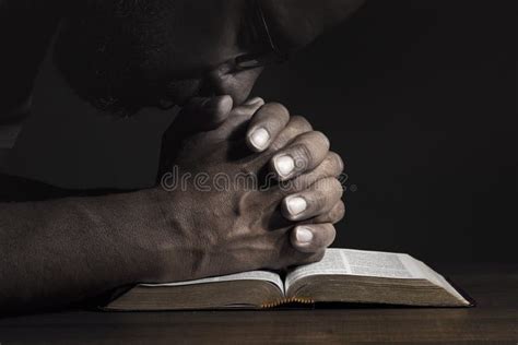 Man Praying To God on a Bible Stock Photo - Image of regret ...