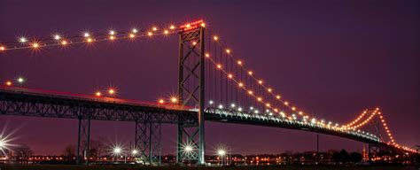 The Ambassador Bridge At Night - Usa To Canada Photograph by Gordon Dean II