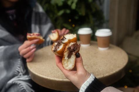 German Donuts - Berliner with Filling and Icing Sugar in Female Hands ...