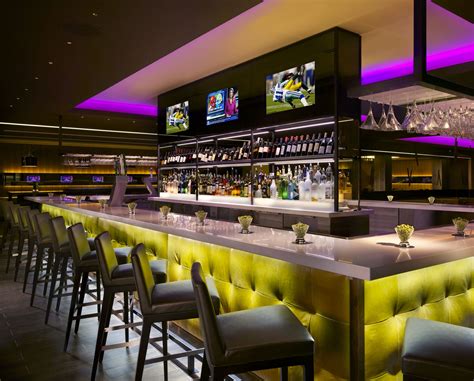 Modern Restaurant Bar Design with Yellow Chairs and Purple Lighting