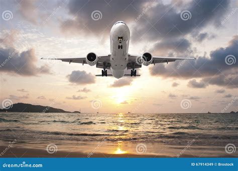 Airplane Landing in sunset stock image. Image of touching - 67914349