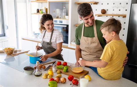 Happy Family in the Kitchen Having Fun and Cooking Together. Stock ...