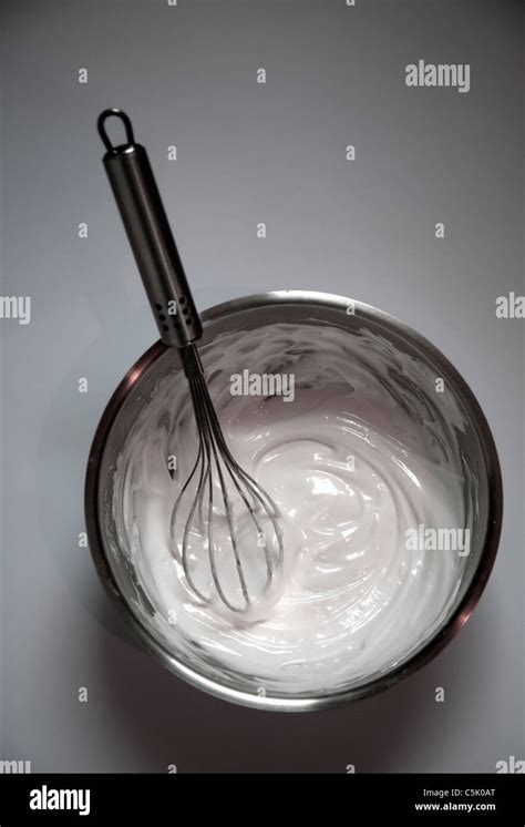 Whisking egg whites Stock Photo - Alamy