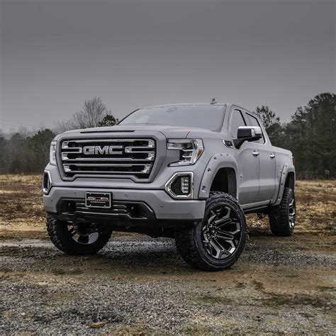 GMC BLACK WIDOW LIFTED TRUCKS — SCA Performance | Black Widow Lifted Trucks