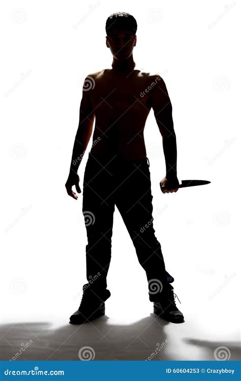 Silhouette Of A Man Holding Knife Stock Photo | CartoonDealer.com #60604253