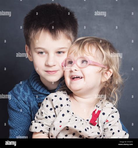 Loving Children Sibling Hugging Stock Photo - Alamy