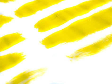 Premium Photo | Yellow acrylic paint stroke isolated on white ...