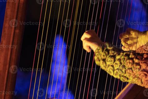 hands playing harp detail 20220956 Stock Photo at Vecteezy