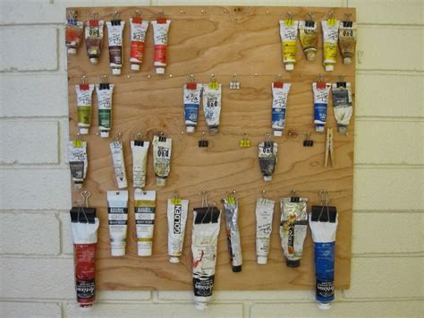 Mike is Bored: Paint tube display and storage rack on wall.