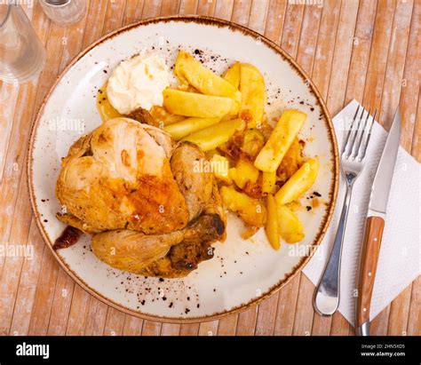 chicken with baked potatoes Stock Photo - Alamy