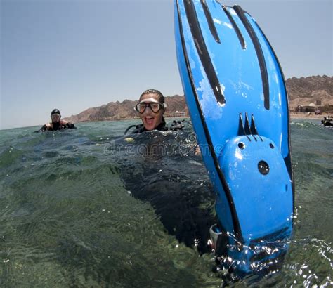 Scuba diver shows her fins stock photo. Image of beautiful - 16275354