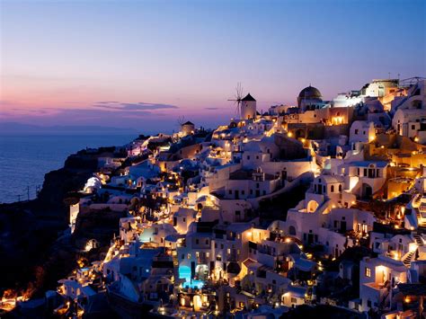 Night view of Oia traditional cave houses in Santorini, Greece | Free ...