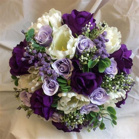 A bridal bouquet of purple, lilac and ivory silk roses & tulips ...