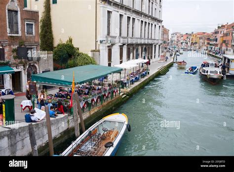 Restaurant at the waterfront, Venice, Italy Stock Photo - Alamy