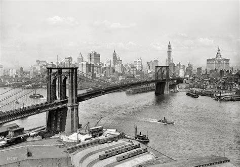 New York circa 1915. "Brooklyn Bridge, East River and skyline." The ...