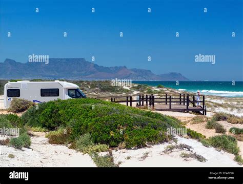 Motorhome and lady stops at the World Class Blouberg Kitesurfing Beach ...