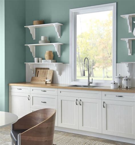 Behr In the Moment in a kitchen with white country style cabinets and ...