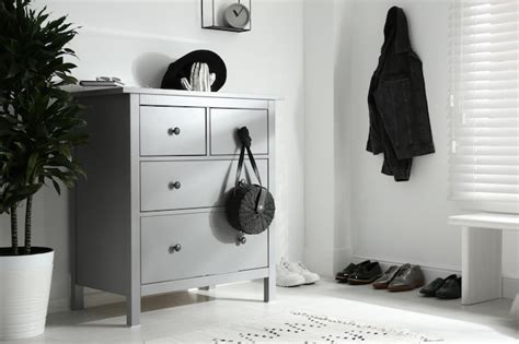 Premium Photo | Grey chest of drawers in stylish room Interior design