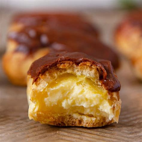 Chocolate Eclairs with creamy vanilla custard filling topped with ...